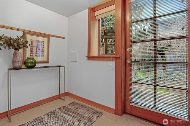 entryway featuring baseboards