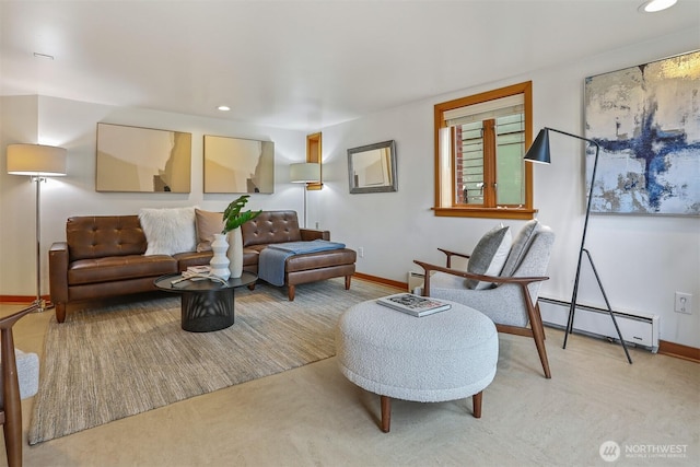 living area featuring recessed lighting, a baseboard heating unit, and baseboards