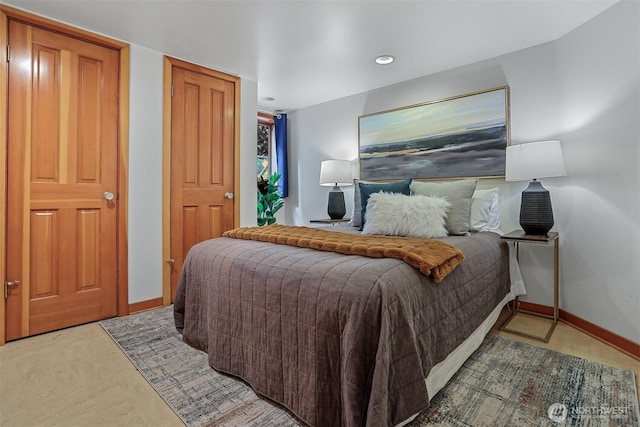 carpeted bedroom with baseboards