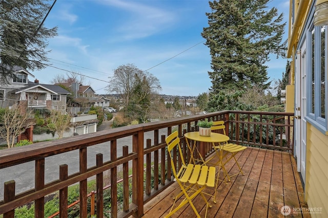 wooden deck featuring a residential view