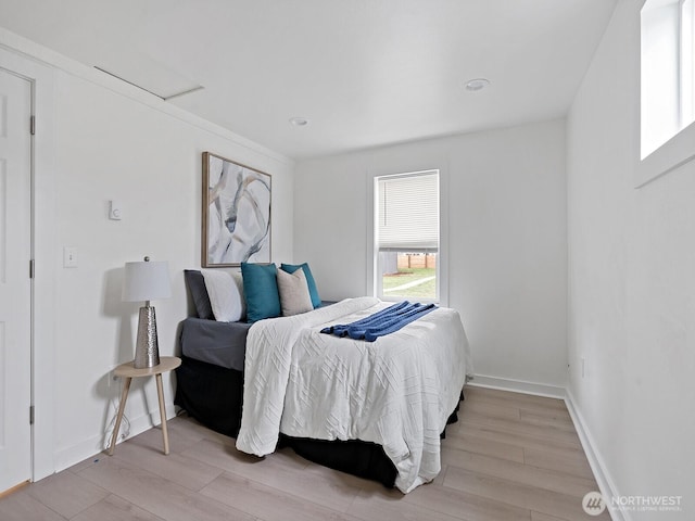 bedroom featuring light wood-type flooring and baseboards