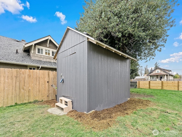 view of shed with a fenced backyard