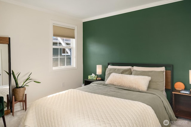 carpeted bedroom featuring crown molding