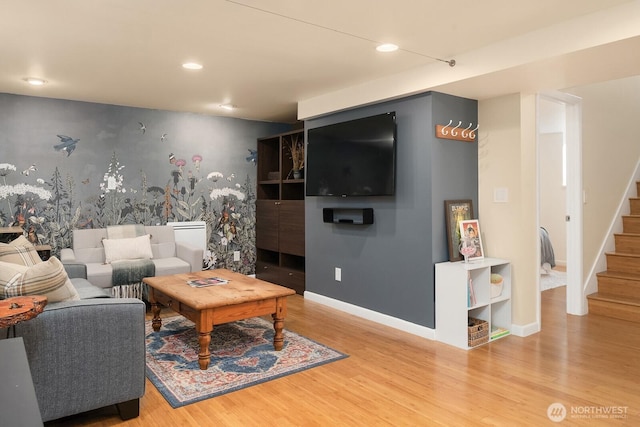 living area with stairway, recessed lighting, baseboards, and wood finished floors