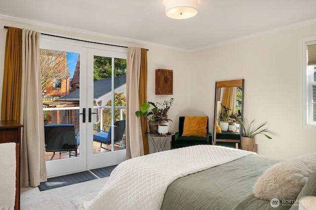 bedroom featuring french doors, multiple windows, crown molding, and access to outside