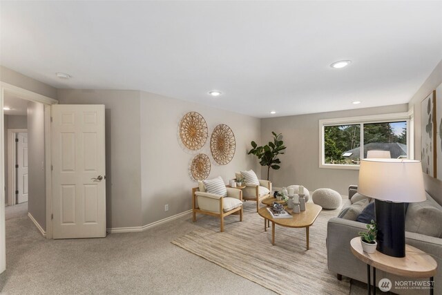 sitting room with recessed lighting, baseboards, and carpet