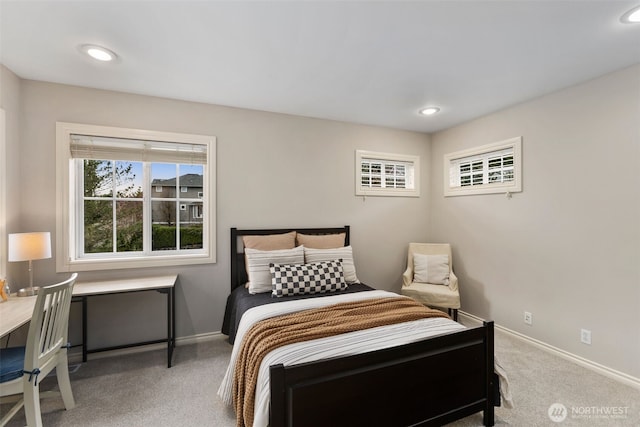 carpeted bedroom featuring recessed lighting and baseboards