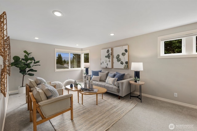 living room with recessed lighting, light colored carpet, and a wealth of natural light