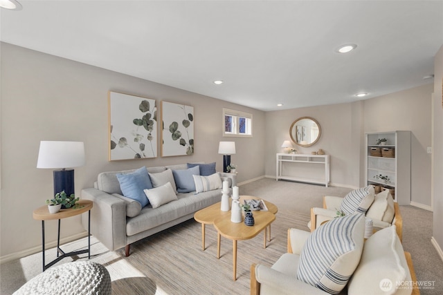 carpeted living area featuring recessed lighting and baseboards