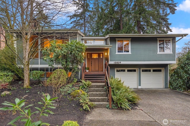 view of front of property featuring driveway and a garage