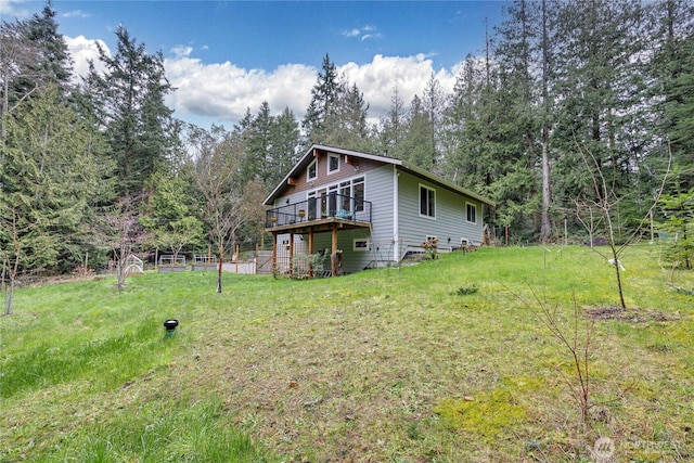 exterior space with a deck and a forest view