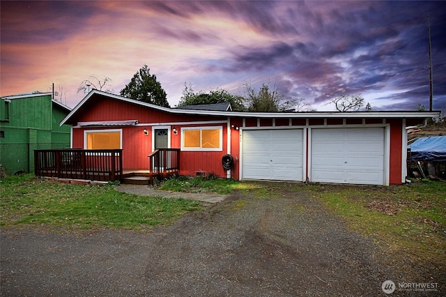 ranch-style house with an attached garage and driveway