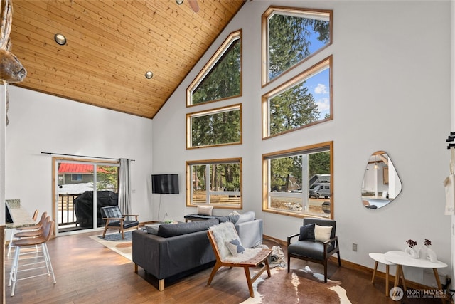 living room featuring baseboards, wood finished floors, high vaulted ceiling, and wooden ceiling