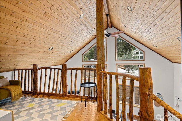 bonus room featuring wood-type flooring, a ceiling fan, wooden ceiling, and vaulted ceiling with beams