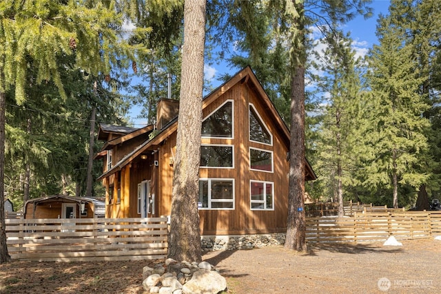 view of property exterior with fence