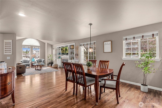 dining room with wood finished floors and baseboards