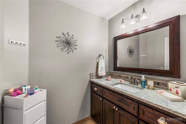 bathroom featuring backsplash and vanity