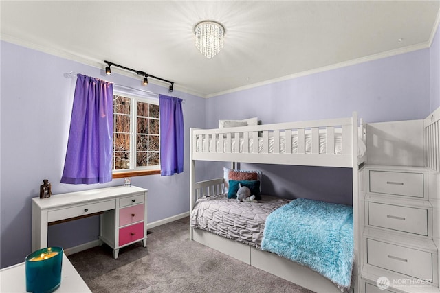 carpeted bedroom featuring baseboards and ornamental molding