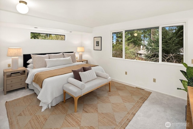 bedroom with baseboards, carpet floors, and visible vents