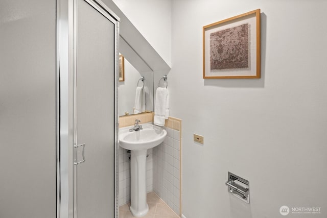 bathroom featuring tile patterned flooring and a sink