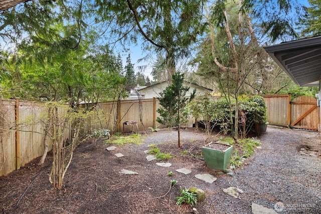 view of yard with a fenced backyard