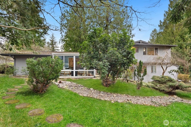 exterior space featuring a sunroom