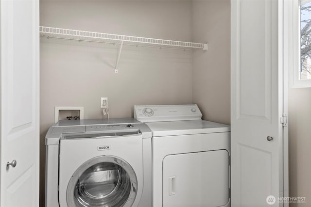 laundry room featuring laundry area and separate washer and dryer