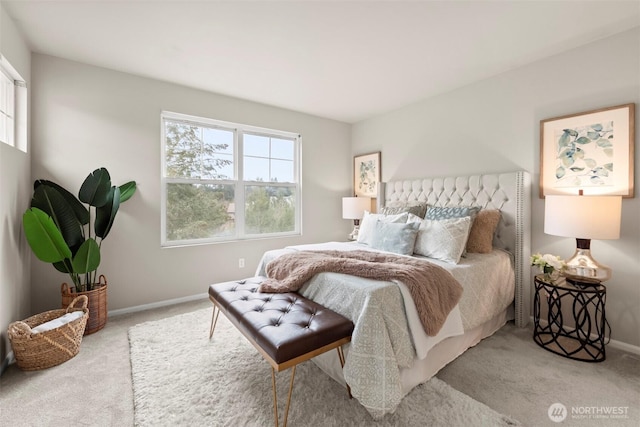 bedroom with baseboards and carpet floors