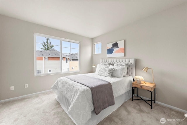 bedroom with carpet flooring and baseboards