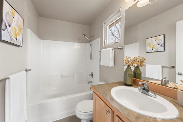 bathroom with shower / tub combination, toilet, and vanity