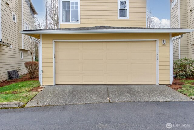 garage featuring driveway