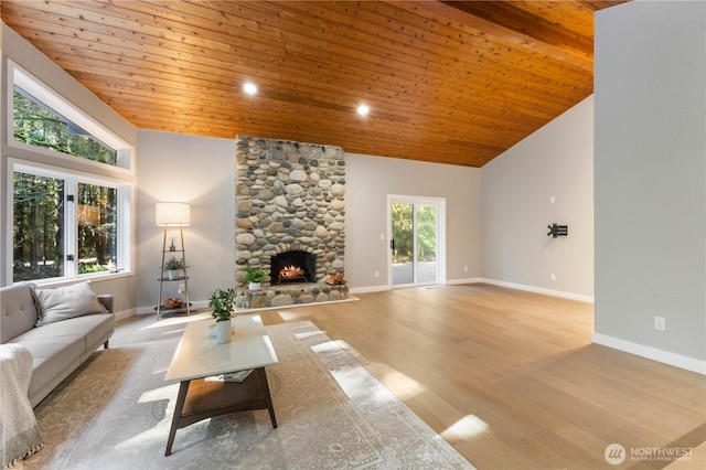 living room with wood finished floors, baseboards, high vaulted ceiling, a fireplace, and wooden ceiling