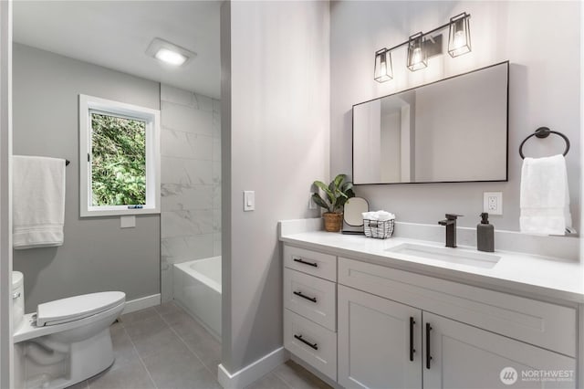 bathroom with vanity, tile patterned floors, toilet, and baseboards