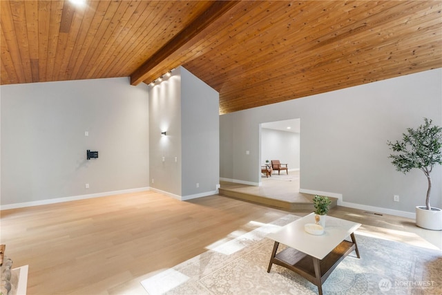 living area featuring baseboards, wood ceiling, light wood-style flooring, and vaulted ceiling with beams