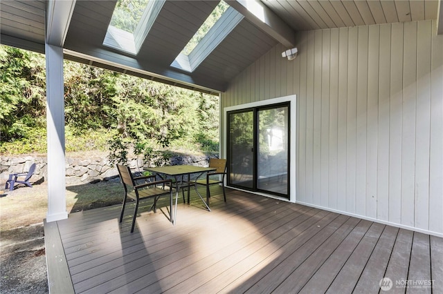 wooden terrace featuring outdoor dining space