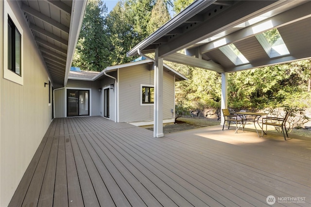 wooden deck featuring outdoor dining space