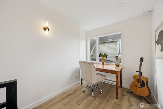 office featuring light wood-style floors and baseboards