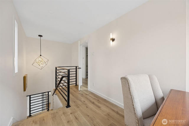 interior space with baseboards and wood finished floors