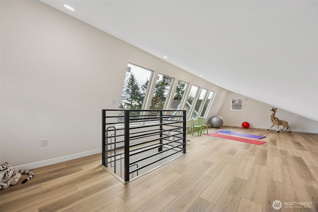 bonus room featuring lofted ceiling, recessed lighting, baseboards, and light wood finished floors