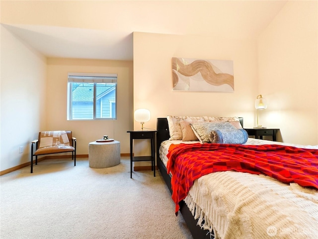 carpeted bedroom featuring baseboards