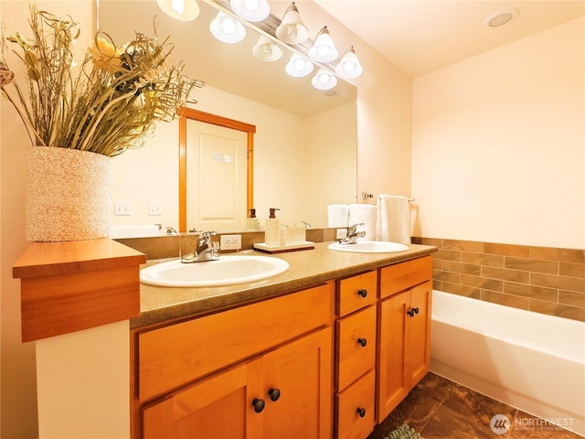 bathroom with tile patterned flooring, double vanity, a washtub, and a sink