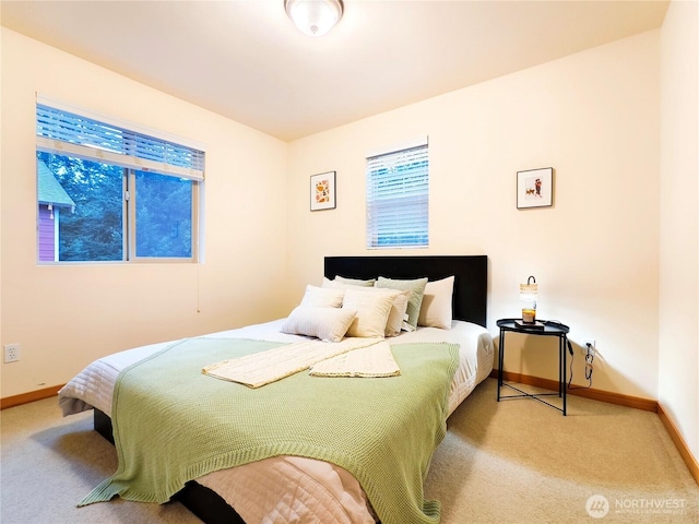 bedroom featuring carpet flooring and baseboards