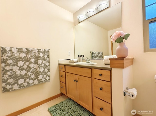 bathroom featuring vanity and baseboards