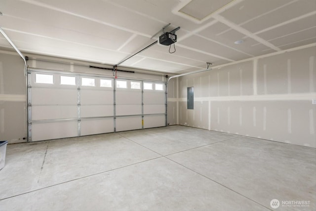 garage with electric panel and a garage door opener