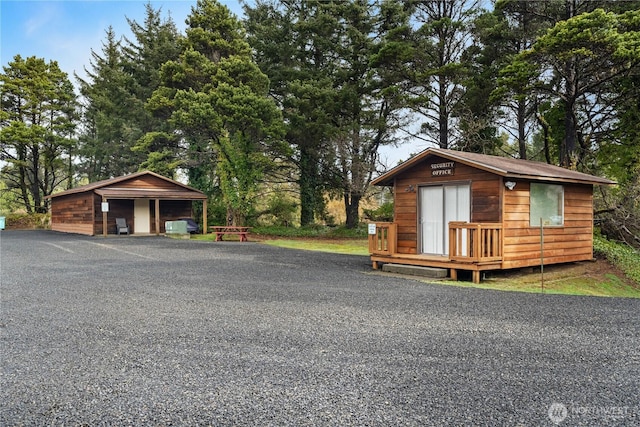 view of front of home with an outbuilding and a detached garage