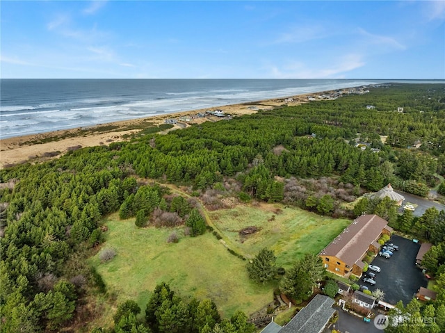 bird's eye view featuring a water view and a beach view