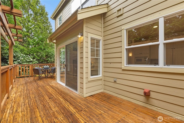 deck featuring outdoor dining space