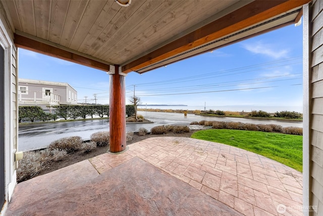 view of patio / terrace with a water view