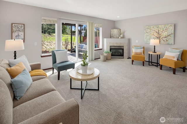 carpeted living room with recessed lighting and a tile fireplace