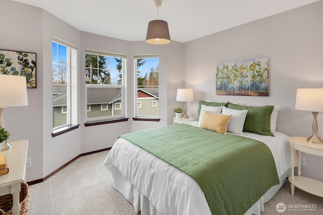 carpeted bedroom with baseboards